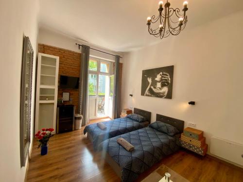 Posteľ alebo postele v izbe v ubytovaní Topolove Rooms & Apartments