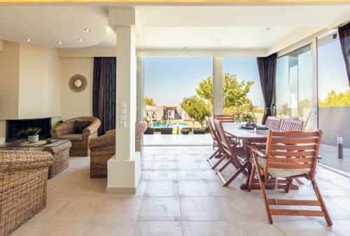 Χώρος καθιστικού στο Istamnos Terra Villa Boho Nest- Shared Pool 1