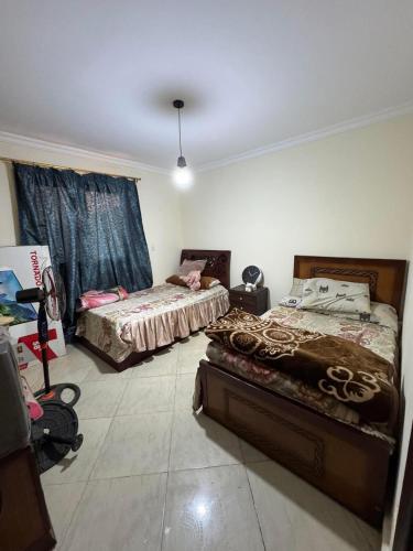 En eller flere senge i et værelse på Dar masr andlos