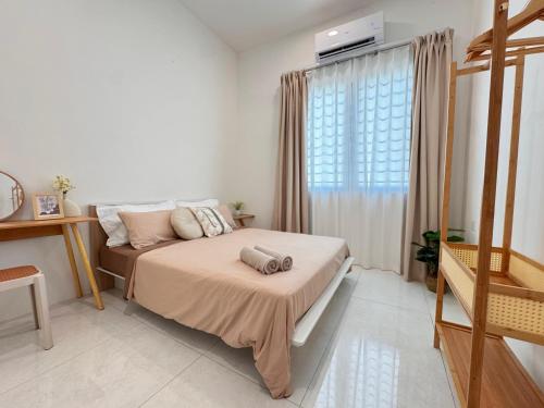 a bedroom with a bed and a window at MokuMoku Miri Homestay FOC Netflix & Ytb 18pax in Miri