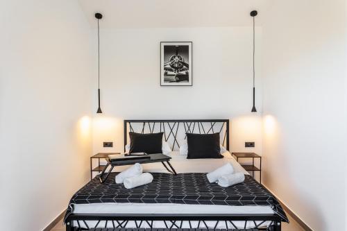 a bedroom with a large bed with two pillows at Villa Vilma-house with heated pool & garden in Trilj