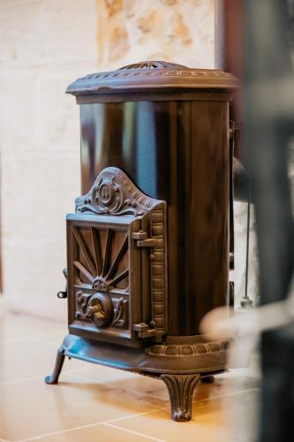 a small wooden box sitting on a table at Mohba Townhouse, Private Roof Top Jacuzzi, Garden, BBQ by Haven & Keys Malta in Xagħra