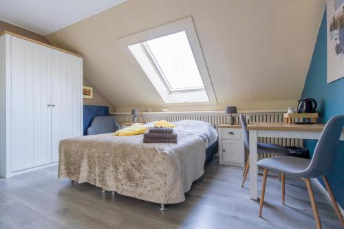Postel nebo postele na pokoji v ubytování B&B Plompetorenzicht