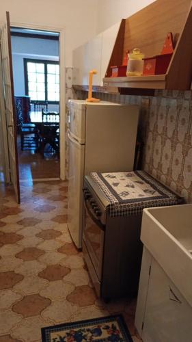 a kitchen with a stove top oven in a room at La casa di Jacky in Apricale