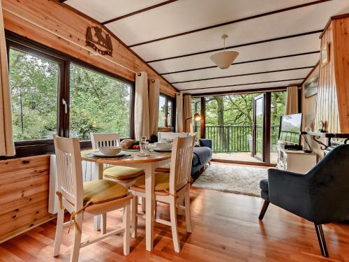 a dining room with a table and chairs at 2 Bed in Ambleside 75731 in Grasmere
