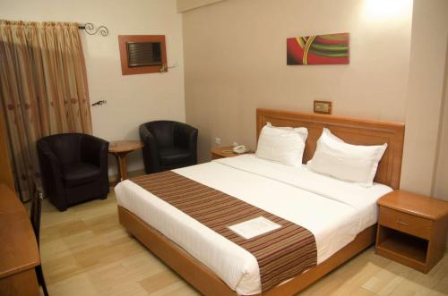 Una cama o camas en una habitación de Hotel Rosebud