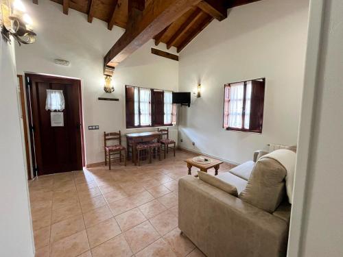 a living room with a couch and a table at Apartamentos Santillana - Mijares 3000 in Mijares