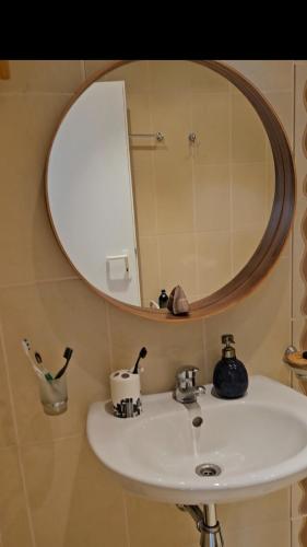 a bathroom with a sink and a mirror on the wall at Boho Breeze Aheloy in Aheloy