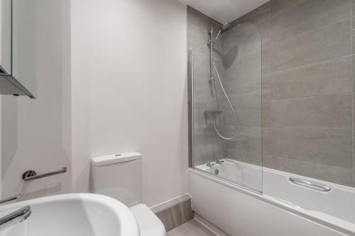 a bathroom with a shower and a toilet and a sink at Garden View in York