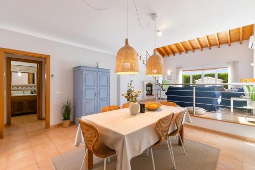 a kitchen and dining room with a table and chairs at Pita's House - Villa Sagres 2 in Sagres