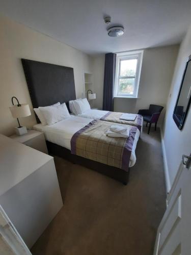 Postel nebo postele na pokoji v ubytování Dalkeith Aparthotel