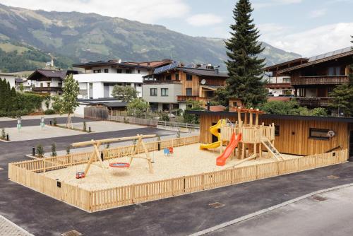 an outdoor playground with a slide at PACHMAIR 1453 apart resort in Uderns