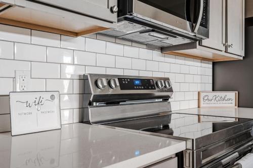 a kitchen with a stove top oven in a kitchen at Spacious Whitestown Getaway in Whitestown
