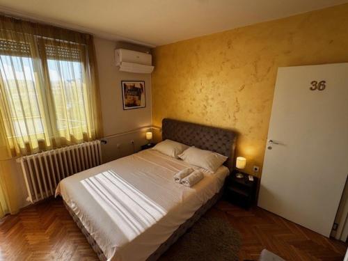 Ένα ή περισσότερα κρεβάτια σε δωμάτιο στο Apartment 36