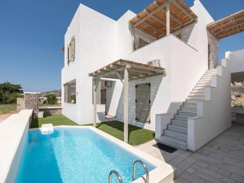 an image of a villa with a swimming pool at Pounta Condo 1 - Shared pool in Pounda
