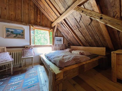 Postel nebo postele na pokoji v ubytování Roubenka na Šumavě