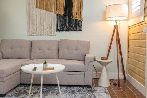 a living room with a couch and a table at King Bed-Step to Madeira Beach-Heated Pool-Private in St Pete Beach
