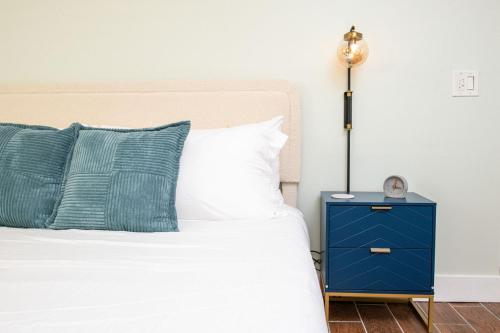 a bedroom with a bed with a blue night stand at King Bed-Step to Madeira Beach-Heated Pool-Private in St Pete Beach