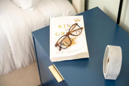 a book with a pair of glasses on a table at King Bed-Step to Madeira Beach-Heated Pool-Private in St Pete Beach