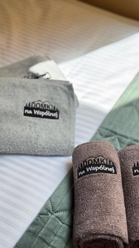 a close up of two towels on a bed at Domki Na Wspólnej in Wisła