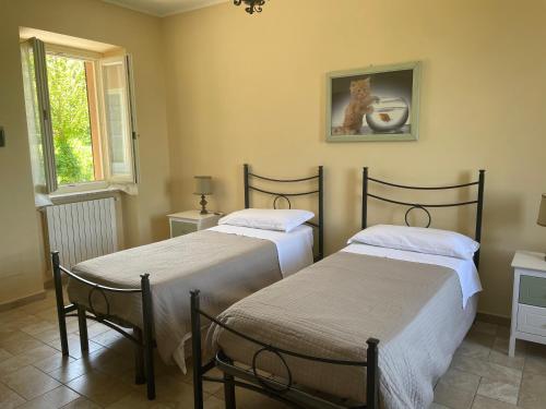 Postel nebo postele na pokoji v ubytování Agriturismo Cascina Anrì