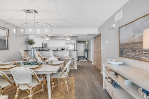 a dining room with a table and chairs at All New Oceanfront Luxury w Lazy River in Myrtle Beach