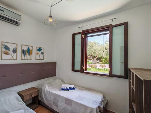 Postel nebo postele na pokoji v ubytování Villa Biancolilla by Holiday World