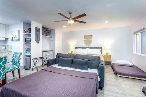a living room with a couch and a bed at Tranquil Riverfront Studio in Three Rivers