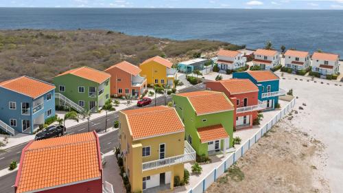 an aerial view of a residential neighborhood with the ocean at Bon Azul 5A in Westpunt