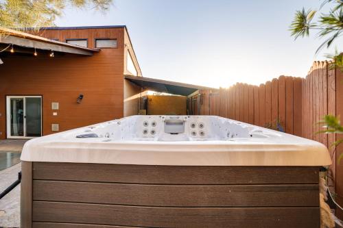 a jacuzzi tub in the backyard of a house at 1-Acre Las Vegas Getaway Pool, Spa and Tennis Court in Las Vegas