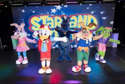 a group of cartoon characters on a stage at The Dean's on the Lune in Heysham