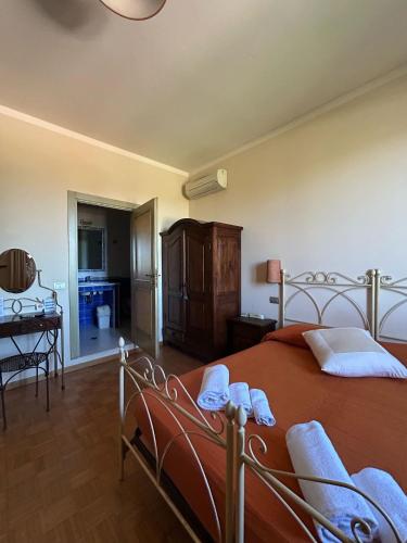 Кровать или кровати в номере Agriturismo La Valle dei Conti