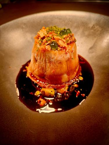 a piece of meat on a plate with sauce at Freemasons at Wiswell in Whalley
