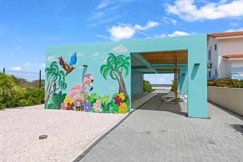 a mural on the side of a building at Punta Azul Ocean Resort 6A in Westpunt