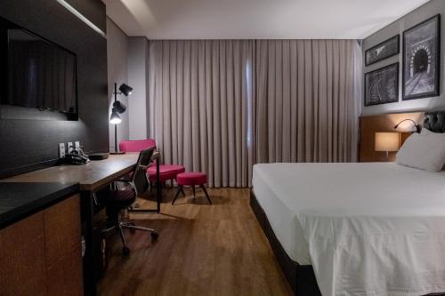 Postel nebo postele na pokoji v ubytování QS Marista Hotel by Atlas