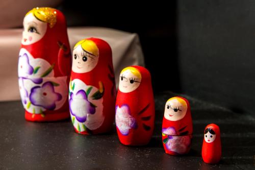 a group of wooden figurines ofativity at Mercatovecchio Luxury Suites in Udine