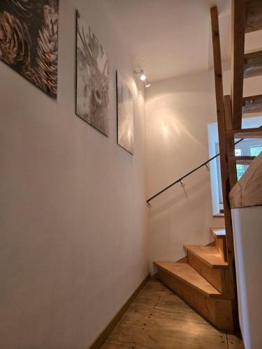 a staircase in a house with wooden floors at Le gîte du Brusquet in Antrenas