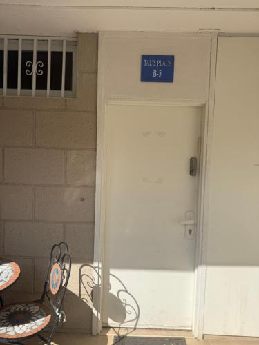 a door to a building with a sign on it at הכינרת מולי in Tiberias