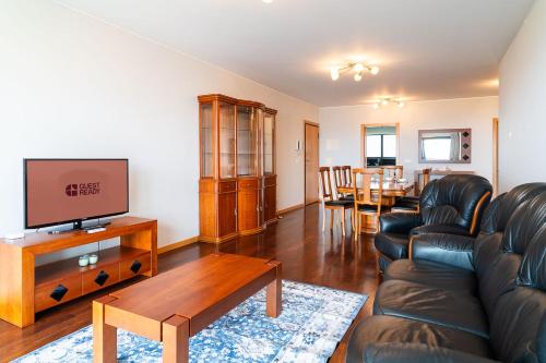 a living room with a couch and a table at GuestReady - Homely stay in Funchal in Funchal