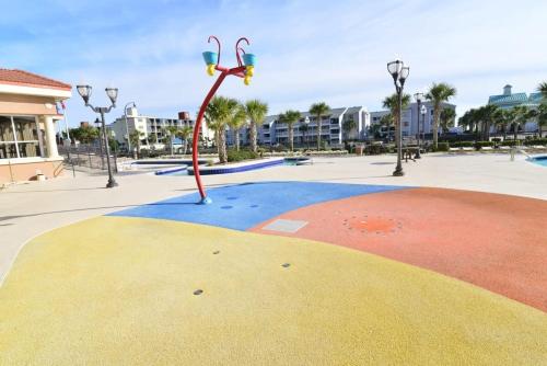 a playground with a basketball hoop in a park at Tilghman Resort Ocean View Paradise Aw Lazy River & Indoor Outdoor Pools in Myrtle Beach