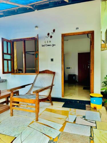 a hammock in a room with a door open at Diyakawa Hotel in Arugam Bay