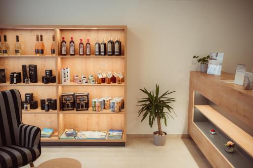 a room with a shelf with bottles of wine at RELAX PARK Třeboň III in Třeboň