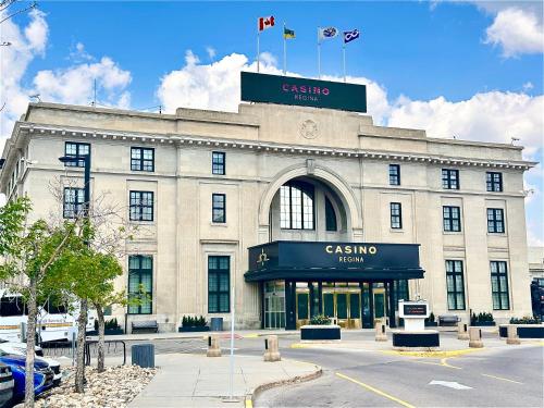 a building with a sign on top of it at Holiday Inn Hotel & Suites Regina by IHG in Regina