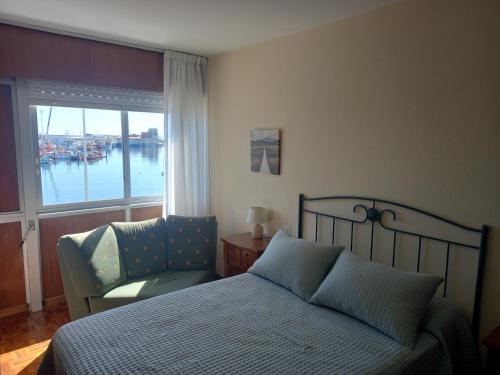 Ένα ή περισσότερα κρεβάτια σε δωμάτιο στο Puerto de Burela
