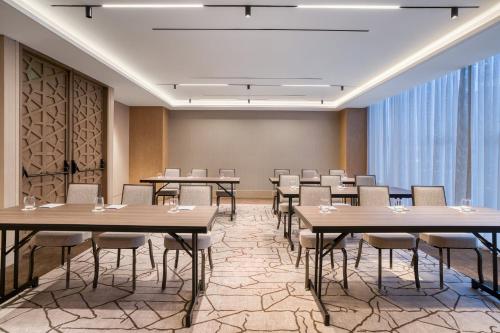 a conference room with tables and chairs and a large window at InterContinental Hotels Real Lima Miraflores by IHG in Lima