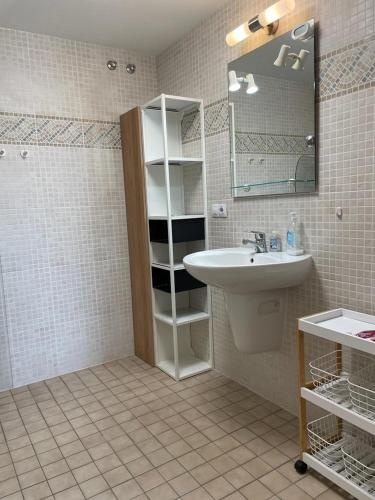 a bathroom with a sink and a mirror at Beautiful Apartment Alfaz del Sol in Alfaz del Pi