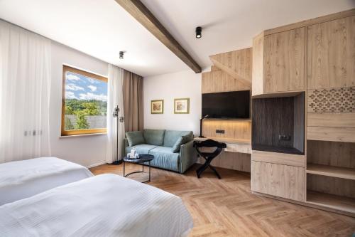 Postel nebo postele na pokoji v ubytování Hotel Julian Alps