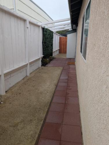 an empty walkway next to a building at Oceano Unit B in Oceano