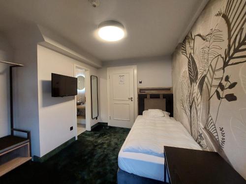 Postel nebo postele na pokoji v ubytování Hotel Rauch