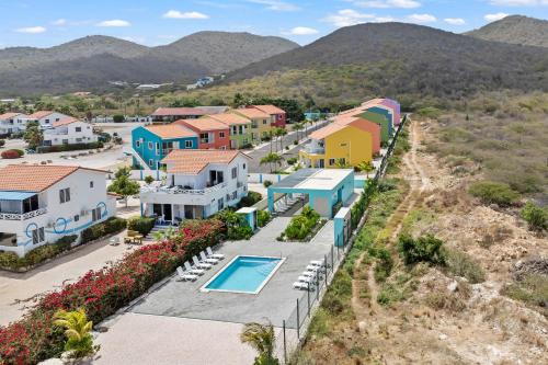 an aerial view of a resort with a swimming pool at Punta Azul 12A ocean resort in Willemstad